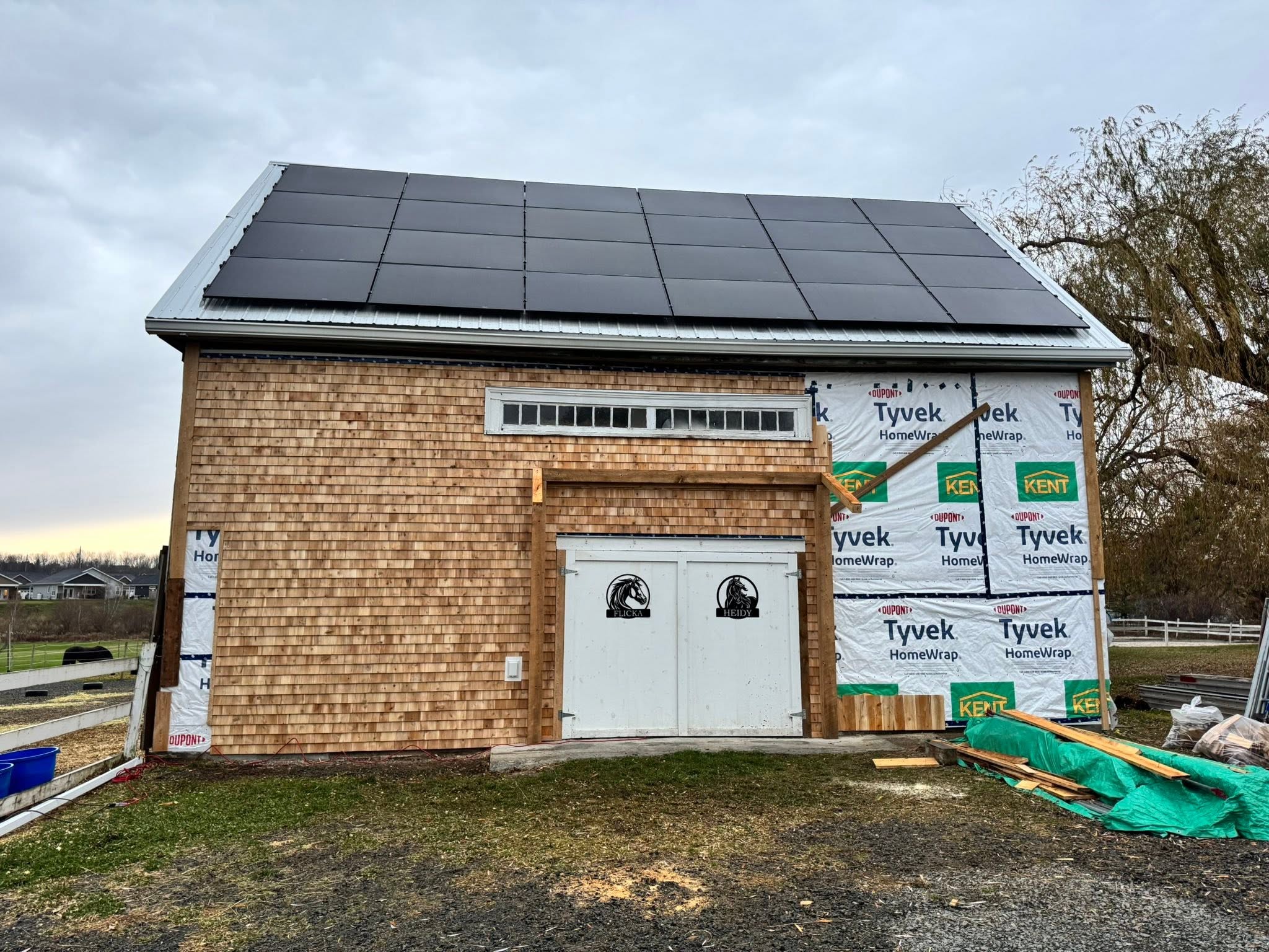 Barn restoration with new cedar siding underway